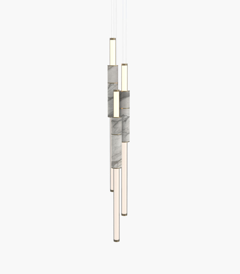Light Pipe S 58—16 White Marble Pendants with Burnished Brass Finish in a clustered configuration